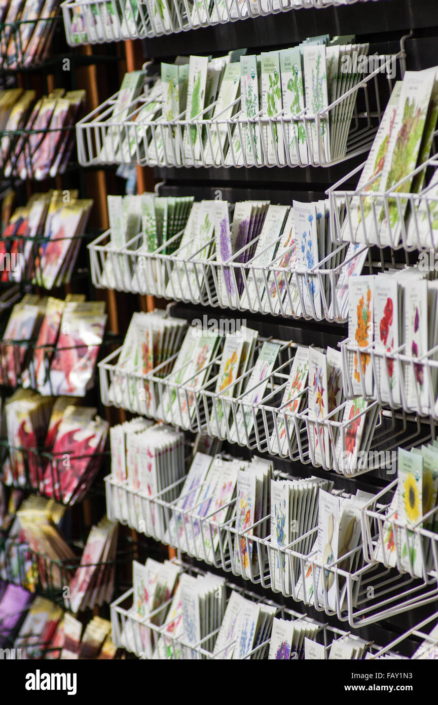 Metal racks of seed packets on display for sale in a garden center