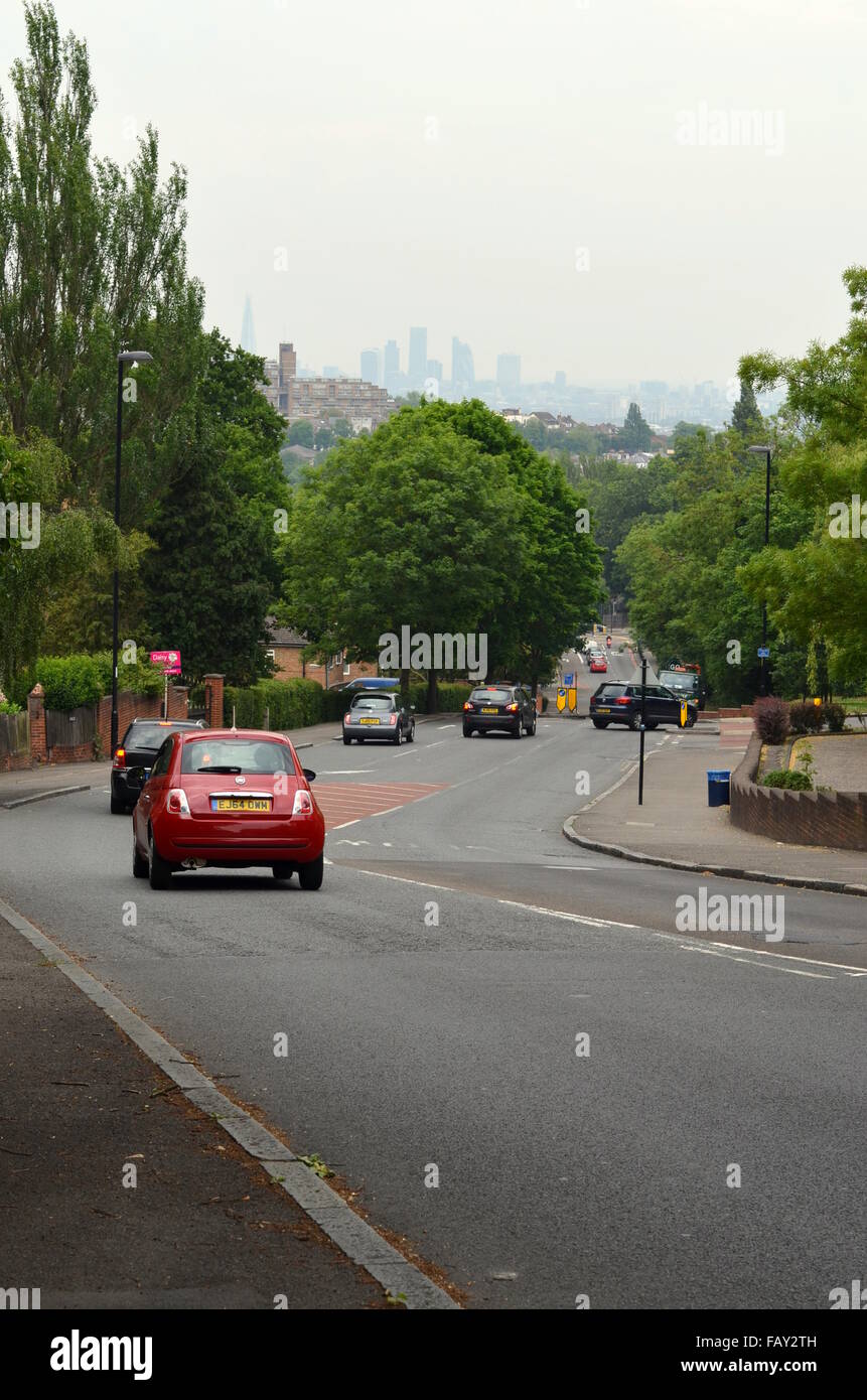 Road downhill with a view towards London city centre, England Stock Photo