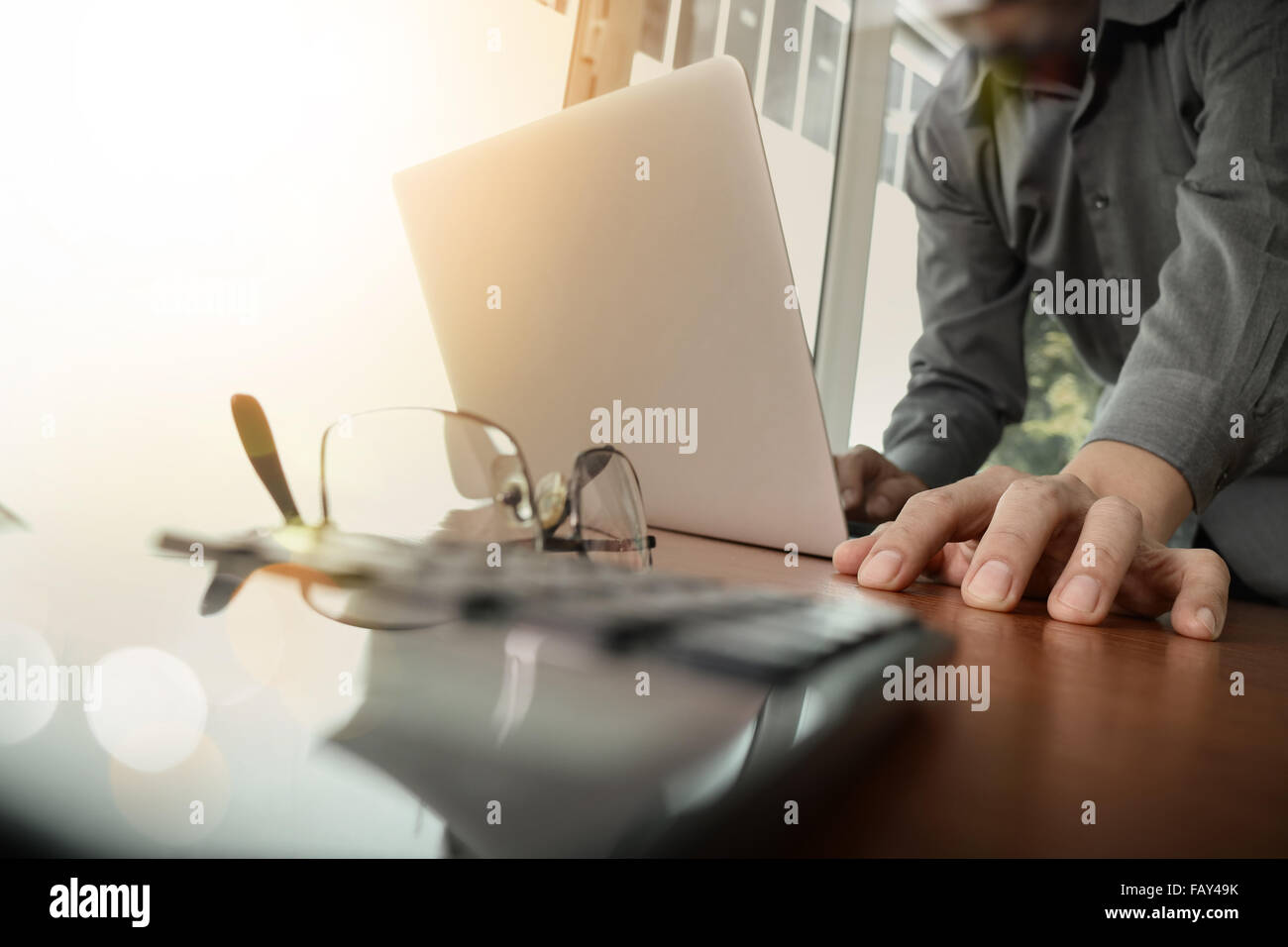businessman hand working with new modern computer and smart phone and ...