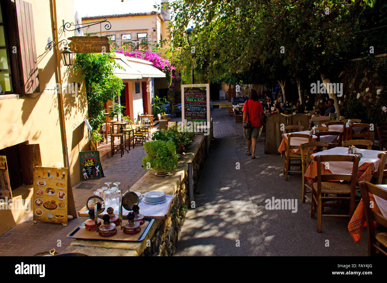 Old town Chania narrow street with restaurants, island Crete, Greece Stock Photo