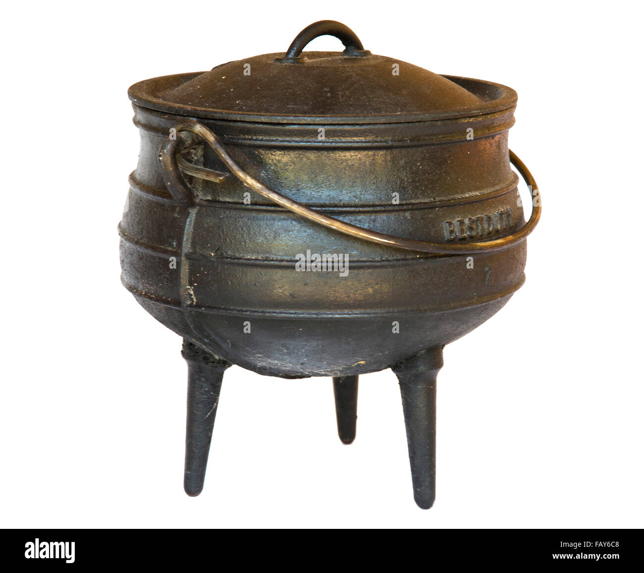 Three-legged black cast iron cooking pot Stock Photo