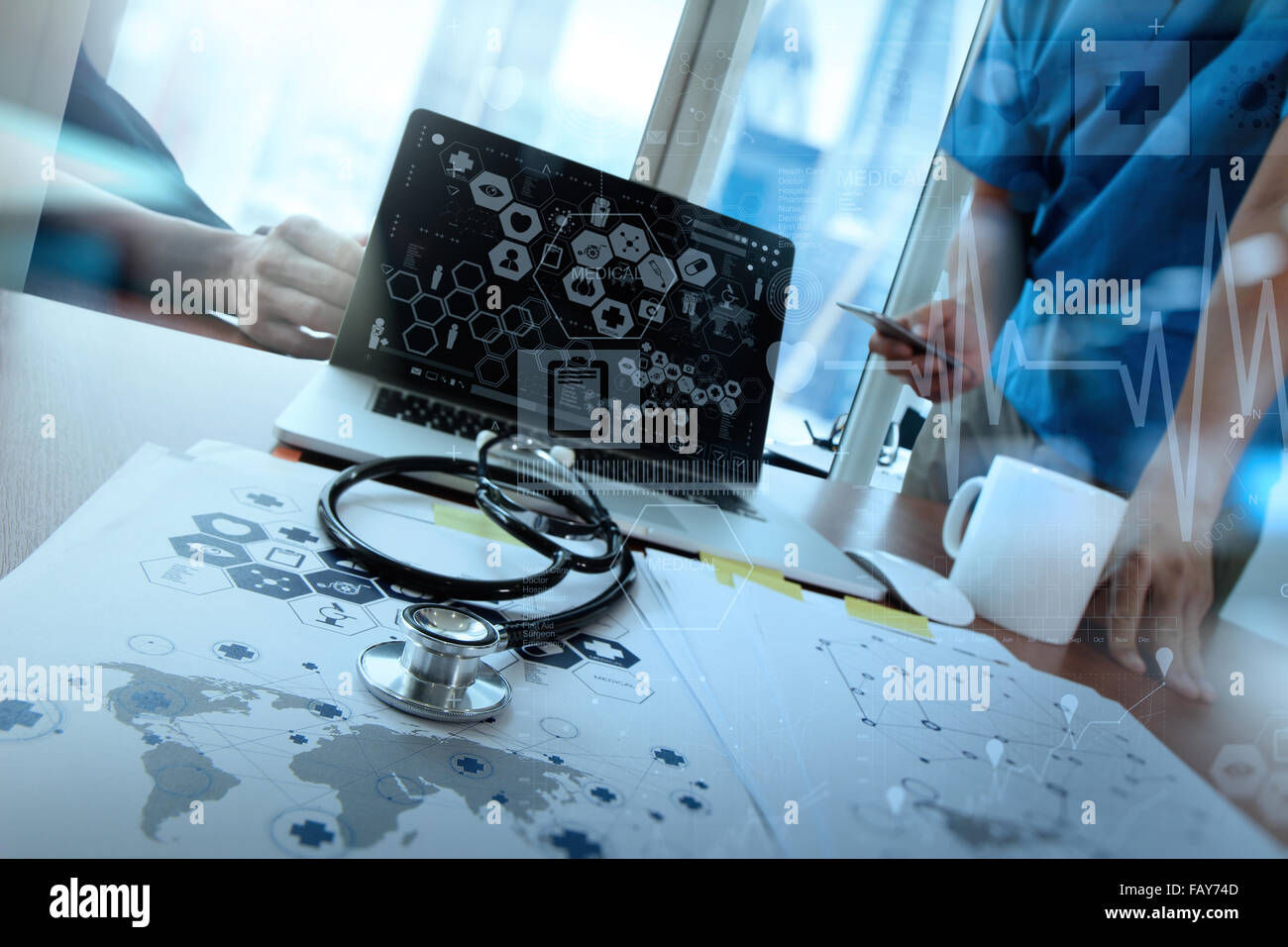 team doctor working with laptop computer in medical workspace office ...
