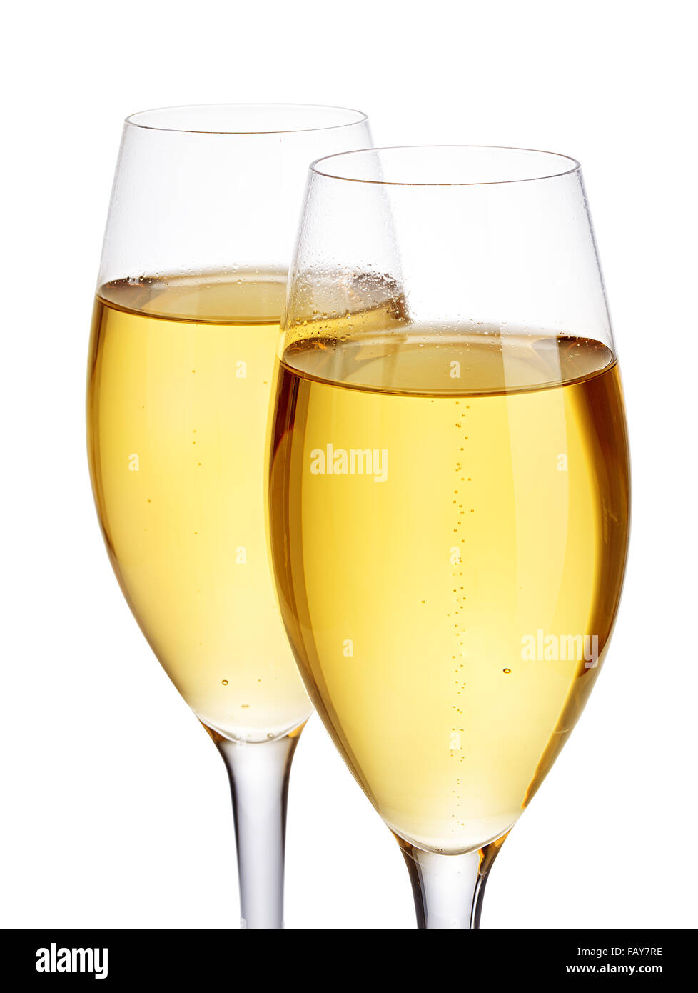 Two elegant champagne glasses closeup isolated on a white background