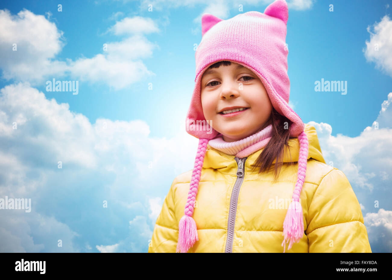 happy beautiful little girl portrait over blue sky Stock Photo - Alamy