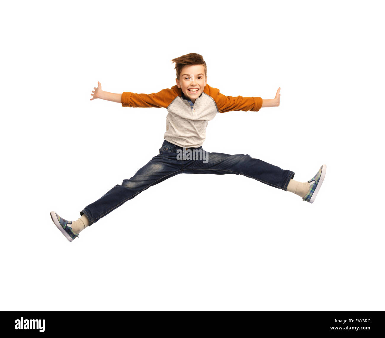 happy smiling boy jumping in air Stock Photo - Alamy