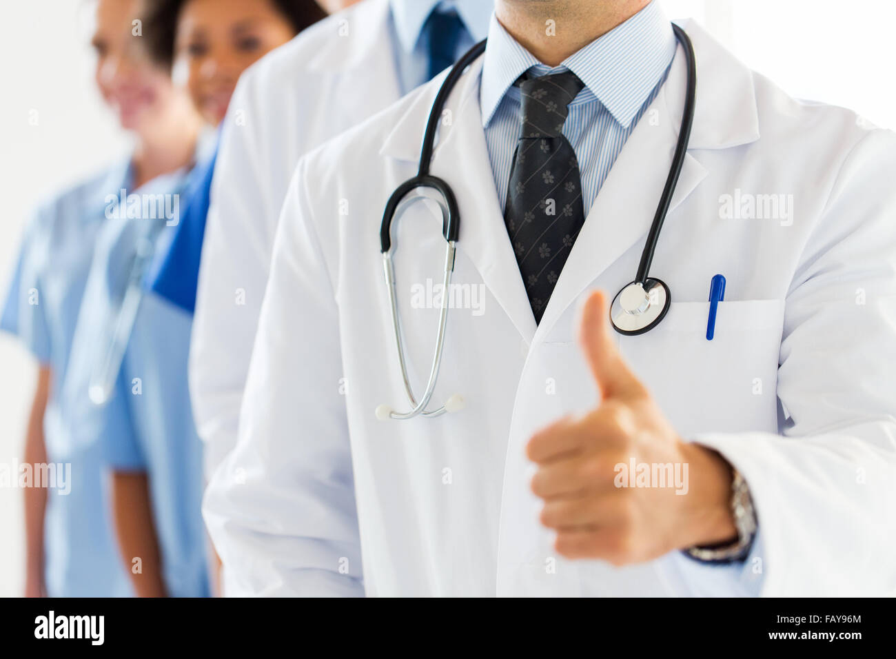 Multiracial male doctor thumbs up hi-res stock photography and images ...