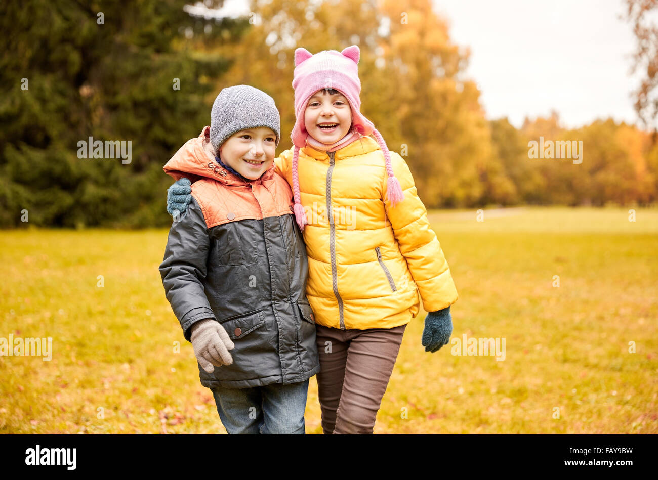 happy little girl and boy in autumn park Stock Photo