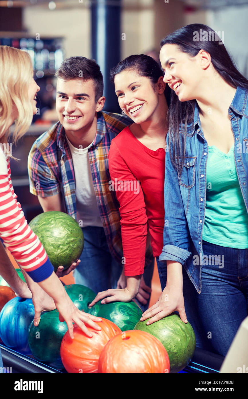 happy friends in bowling club Stock Photo