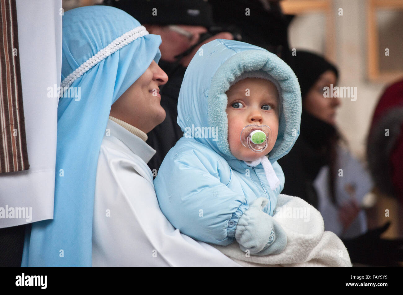 Reenactor as Virgin Mary with baby Jesus Christ,  at Epiphany Holiday celebration in Wroclaw, Lower Silesia, Poland Stock Photo