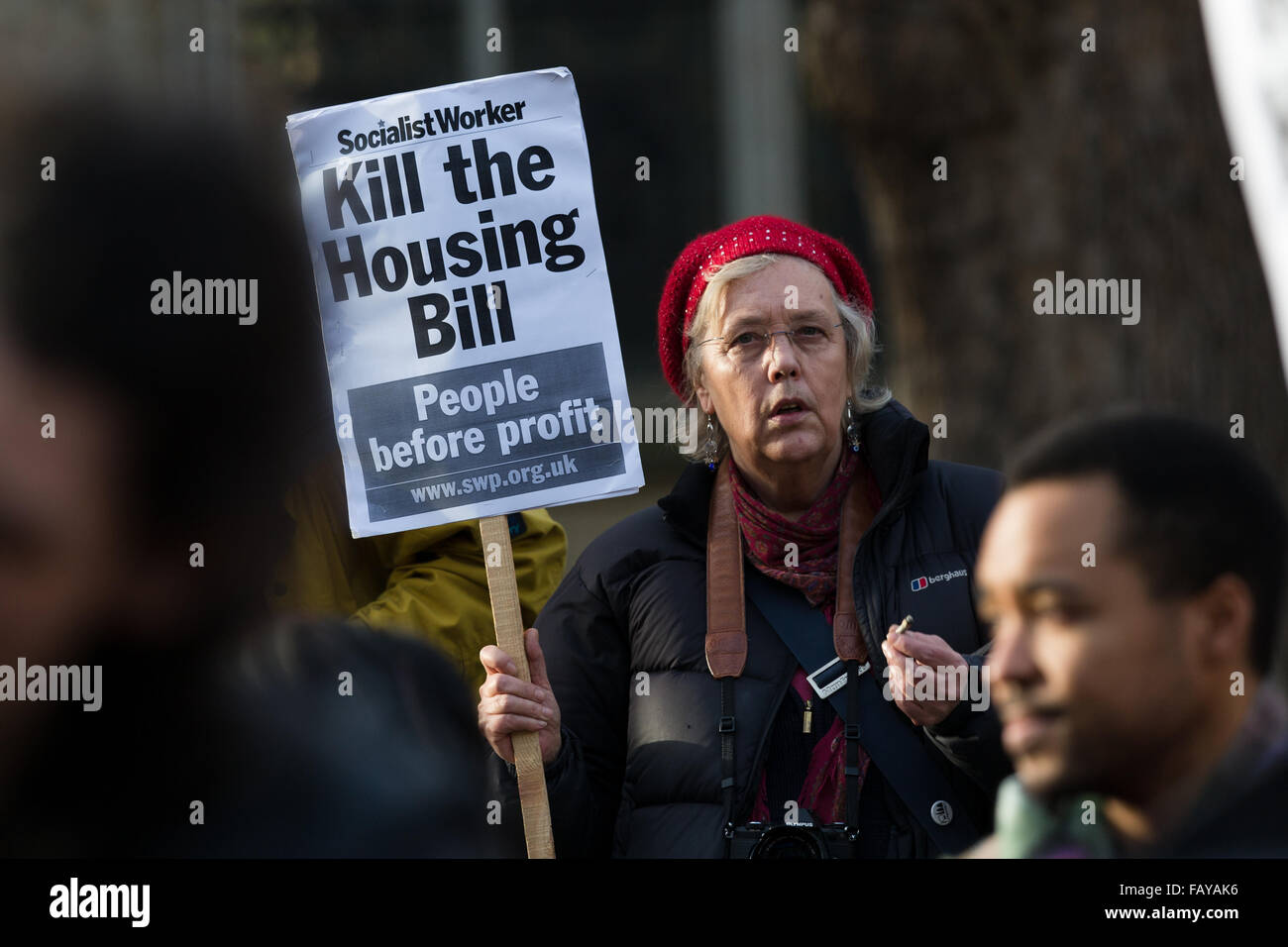 London, UK. 5th January, 2016. Demonstrators from Defend Council Housing (DCH), housing groups, trades unions and Class War protest against the Housing Bill outside the Houses of Parliament in Westminster, London. Members of Parliament (MP’s) are debating the Housing and Planning Bill, which makes provisions about social housing, right to buy, estate agents, rent charges, planning and compulsory purchase. Protesters claim that the Housing Bill, if passed will effectively end council housing. Stock Photo