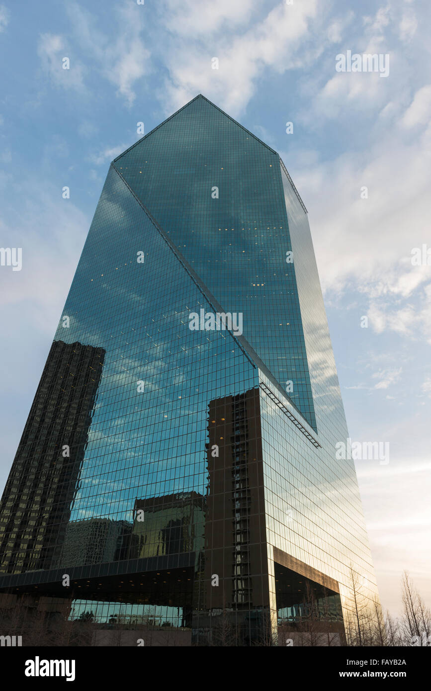 Low angle view of an office building with glass walls reflecting other buildings; Dallas, Texas, United States of America Stock Photo