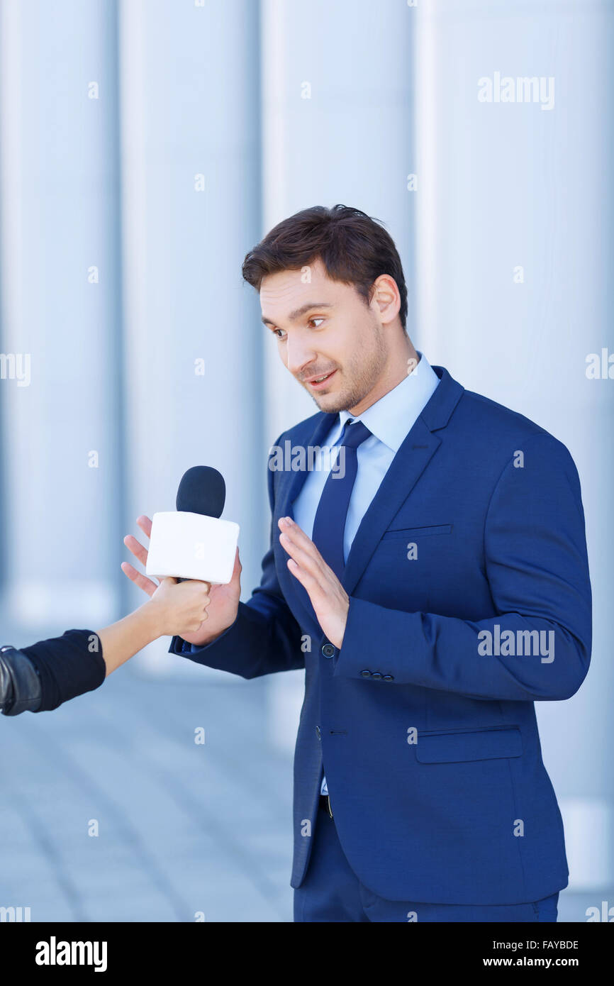 Young gentleman is not willing to speak. Stock Photo