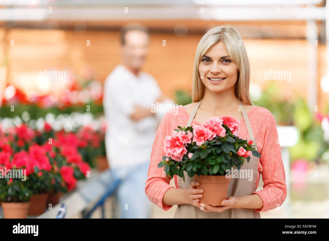 Professional florist selling flowers Stock Photo Alamy