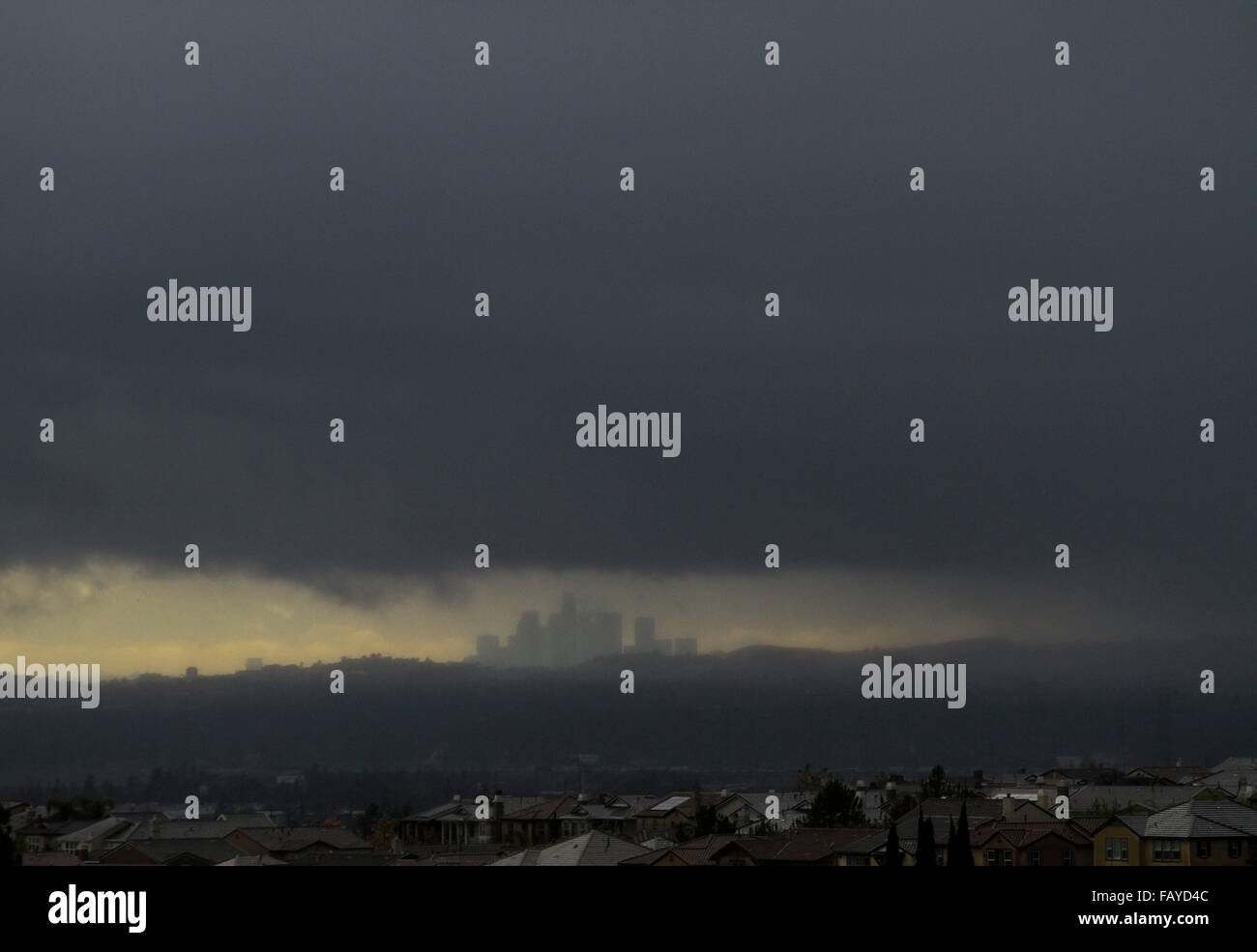 Los Angeles, USA. 5th Jan, 2016. Storm clouds are seen over the skyline ...