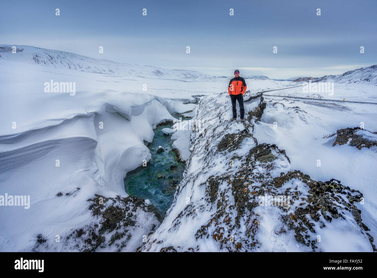 Man standing by river, Lake Myvatn, Iceland Stock Photo