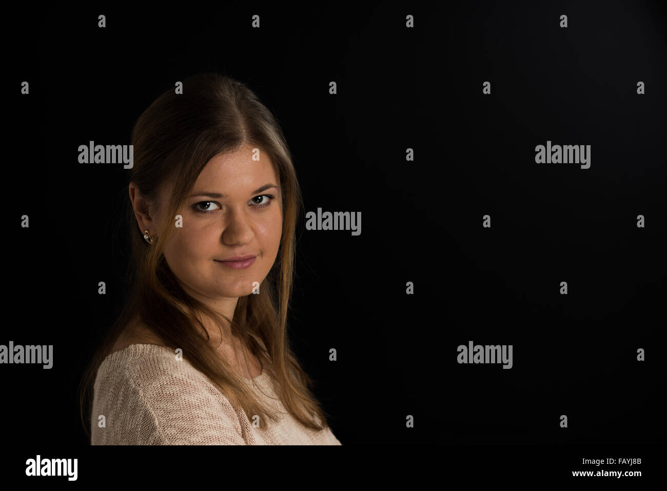 portrait of young woman on the black background Stock Photo - Alamy