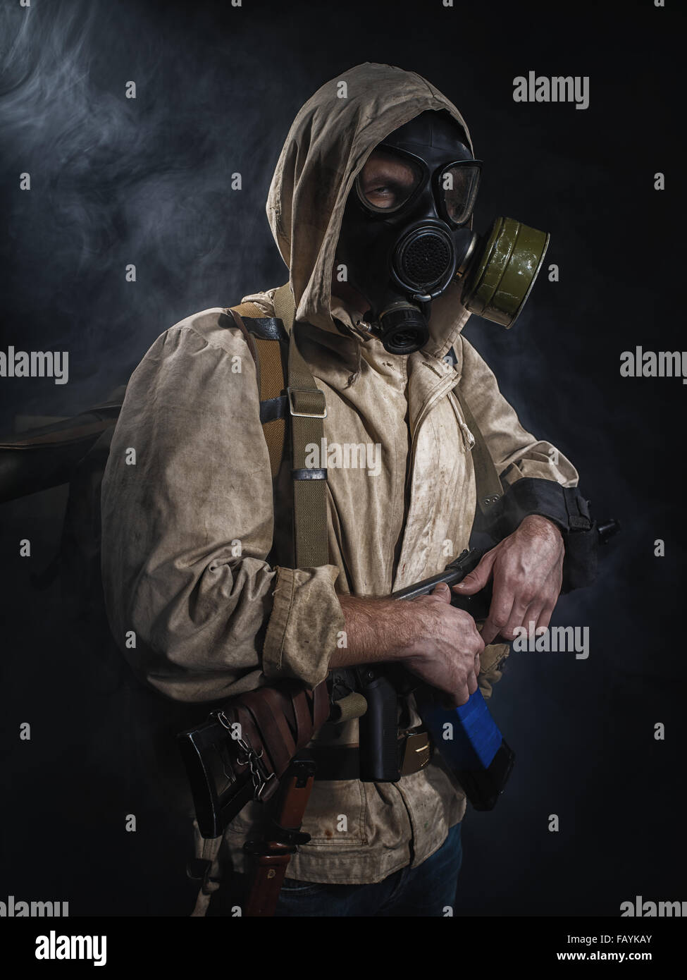 Armed man in protective mask. Stalker. Post-apocalyptic fiction Stock Photo
