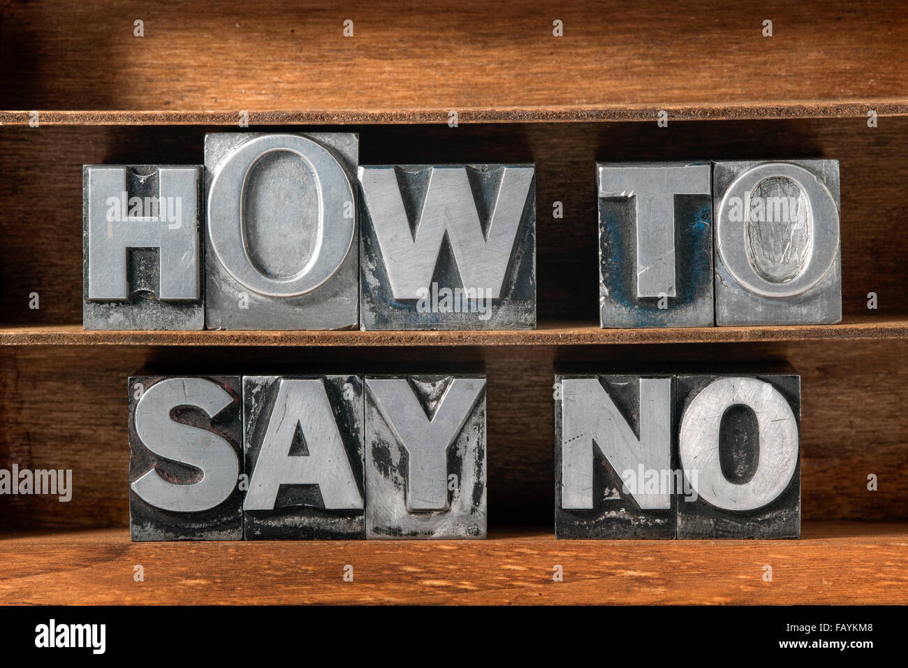 how to say no phrase made from metallic letterpress type on wooden tray Stock Photo