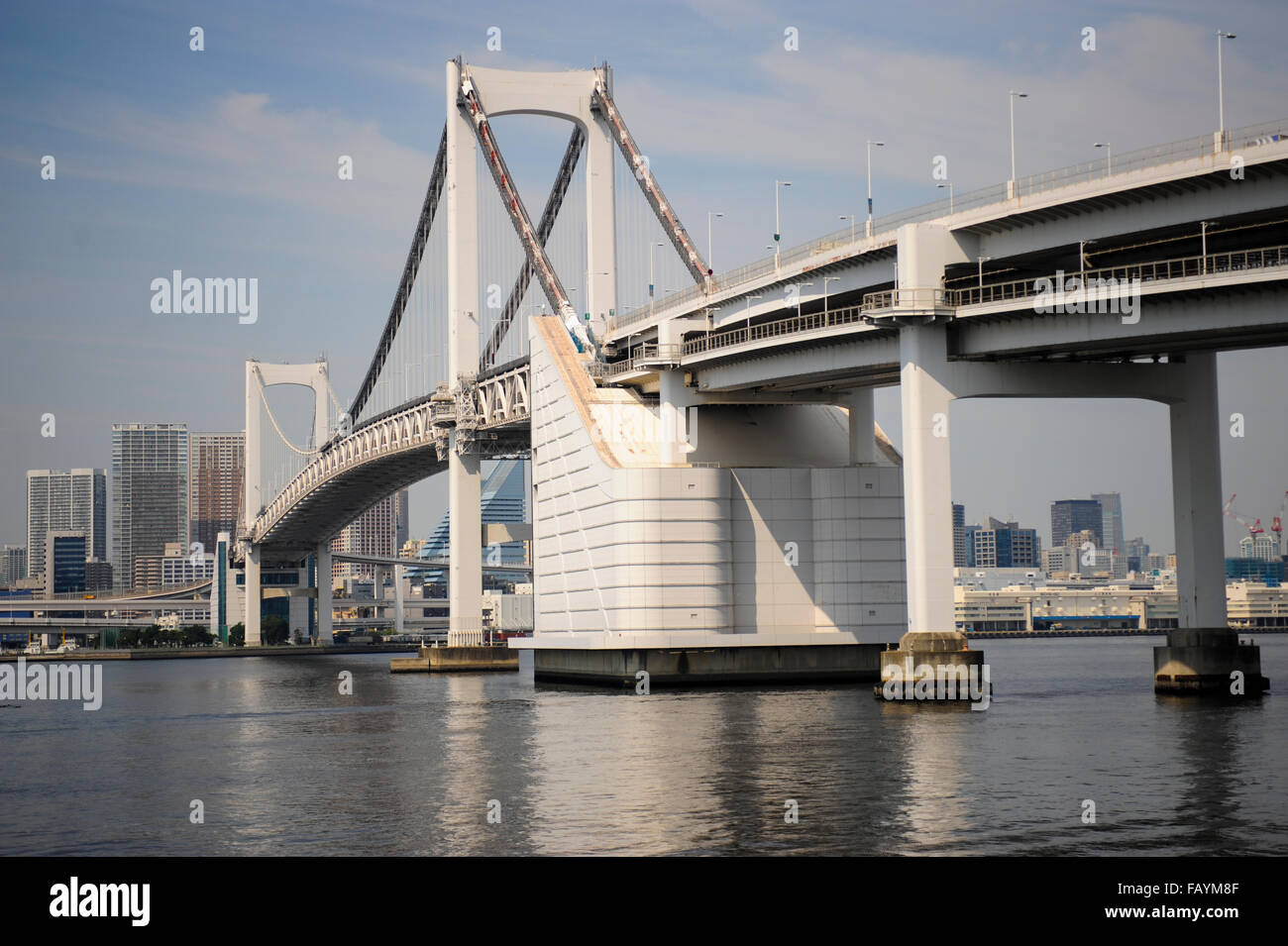 The Rainbow bridge on the Sumida river, Odaiba beach Tokyo bay Japan Stock Photo