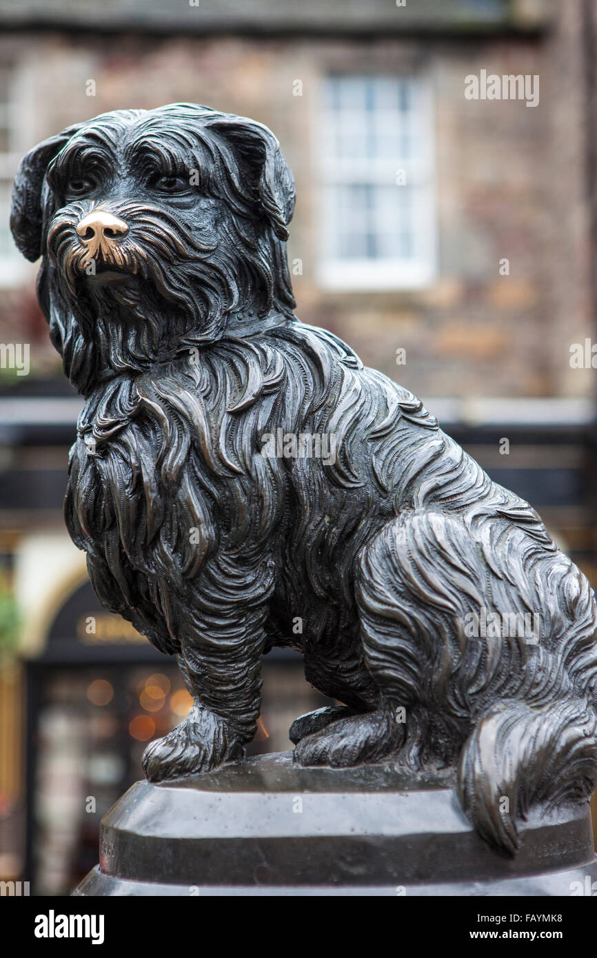 A statue of Greyfriars Bobby in Edinburgh, Scotland.  Bobby was a Skye Terrier who supposedly spent 14 years guarding the grave Stock Photo