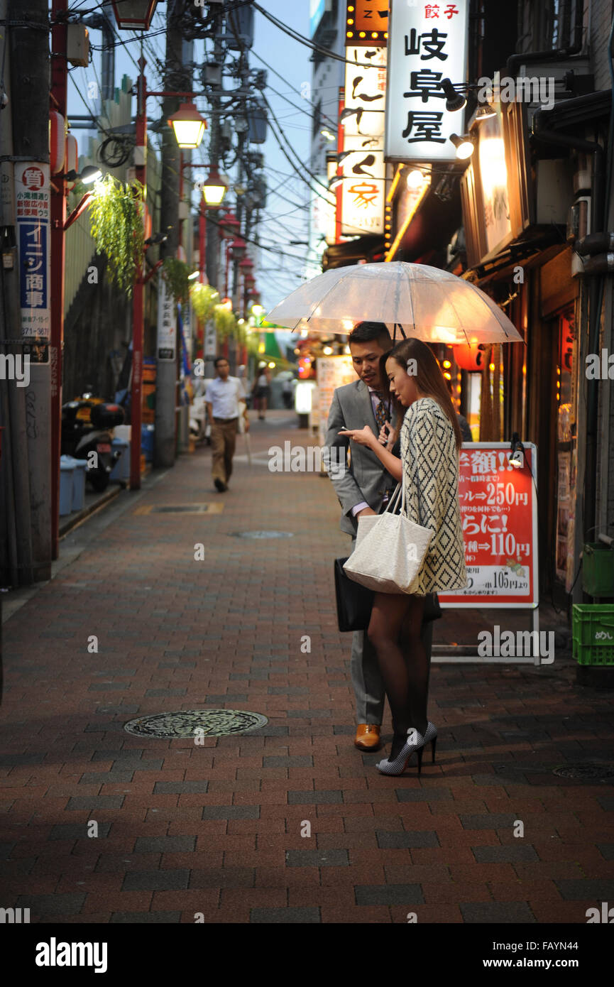 Japanese couple in Shinjuku Tokyo Japan Stock Photo