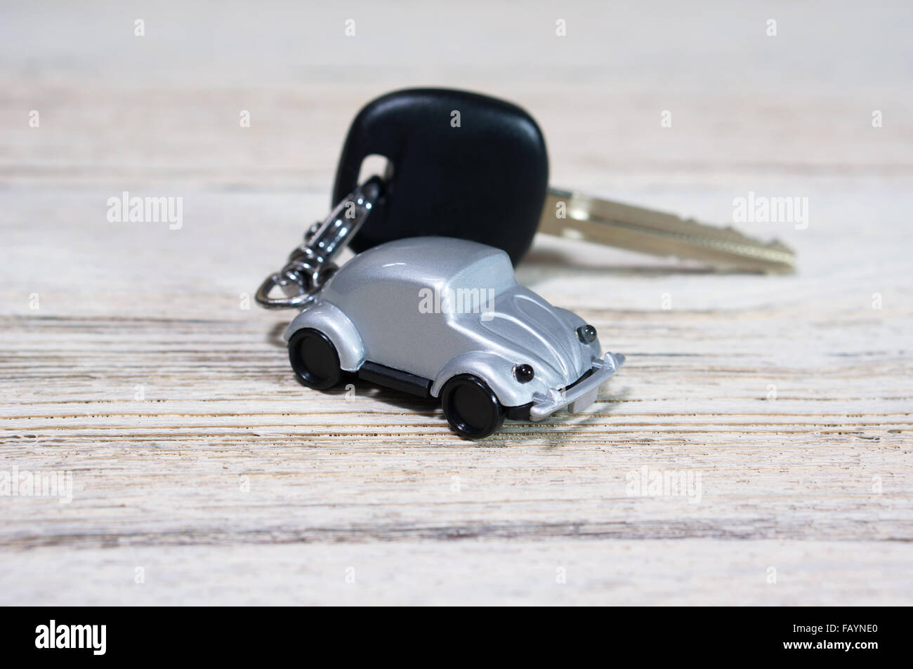 Car toy with key on white wood table Stock Photo