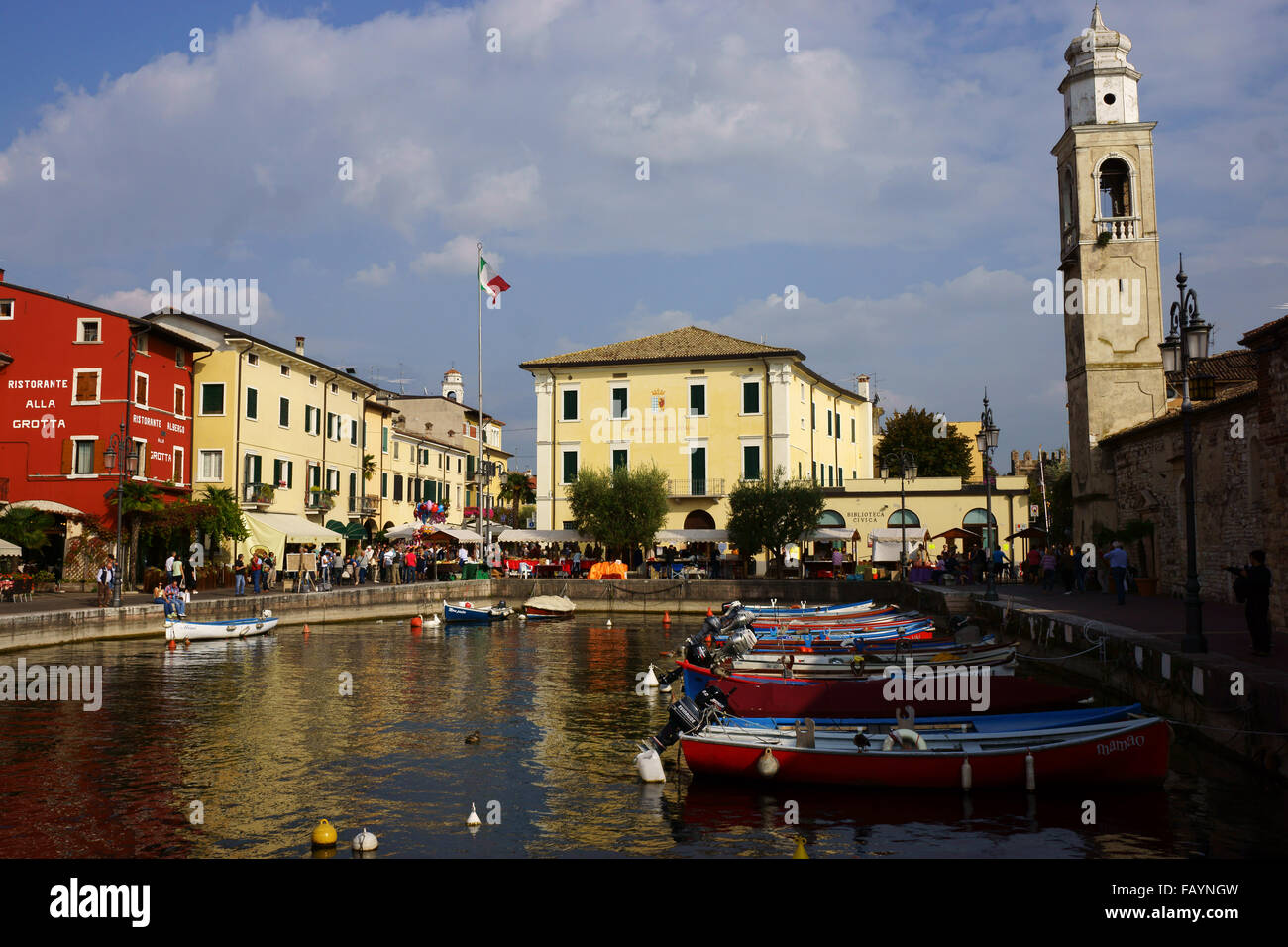 Harbor, church San Nicolo and historic town of Lazise, Lake Garda, Province Verona, Italy Stock Photo