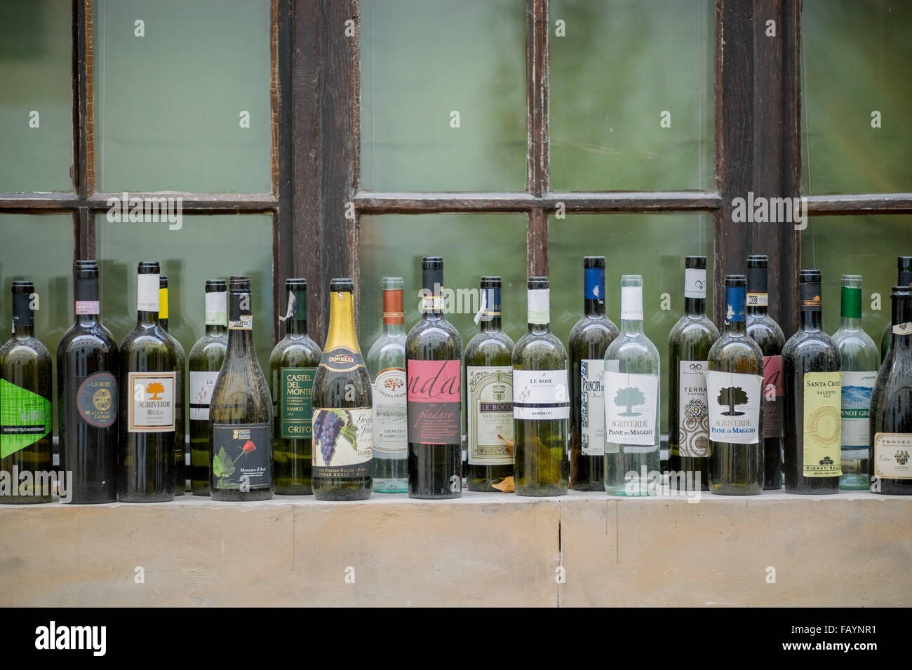 Empty wine bottles standing on the windowsill Stock Photo Alamy