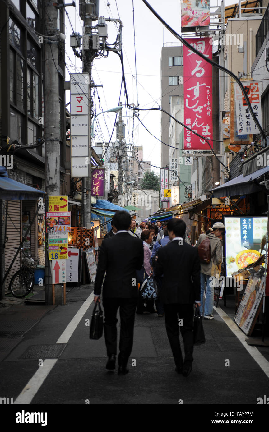 two business men walking in Shinjuku Tokyo Japan Stock Photo