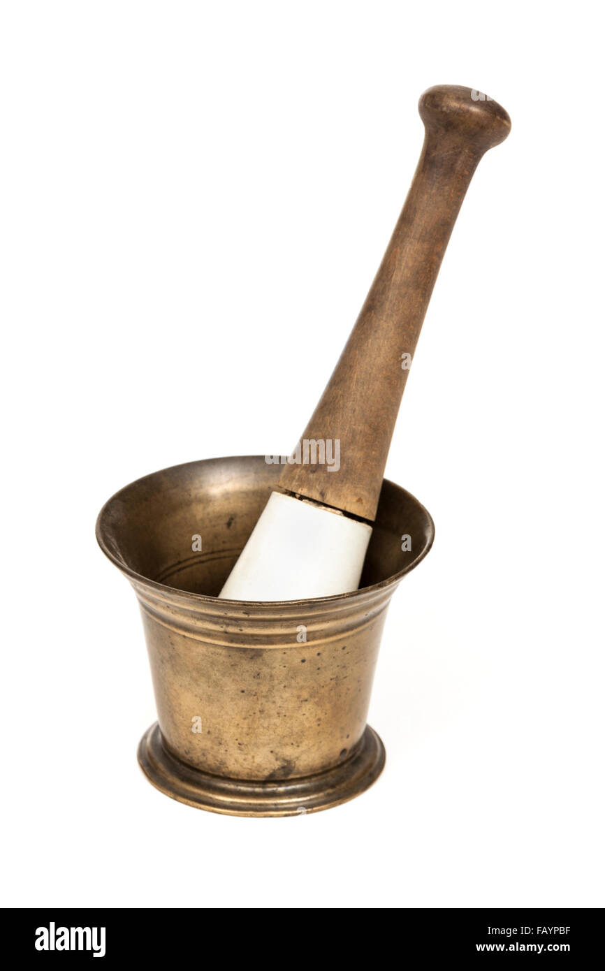 Antique brass mortar with bone and wood pestle Stock Photo