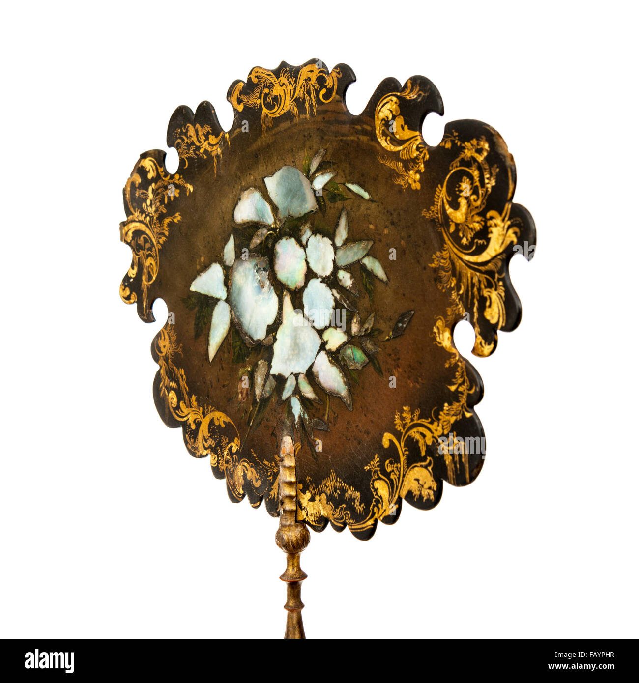 Antique Victorian (c.1850) handheld ornate fireplace face screen, made from papier mache with mother-of-pearl inlay Stock Photo