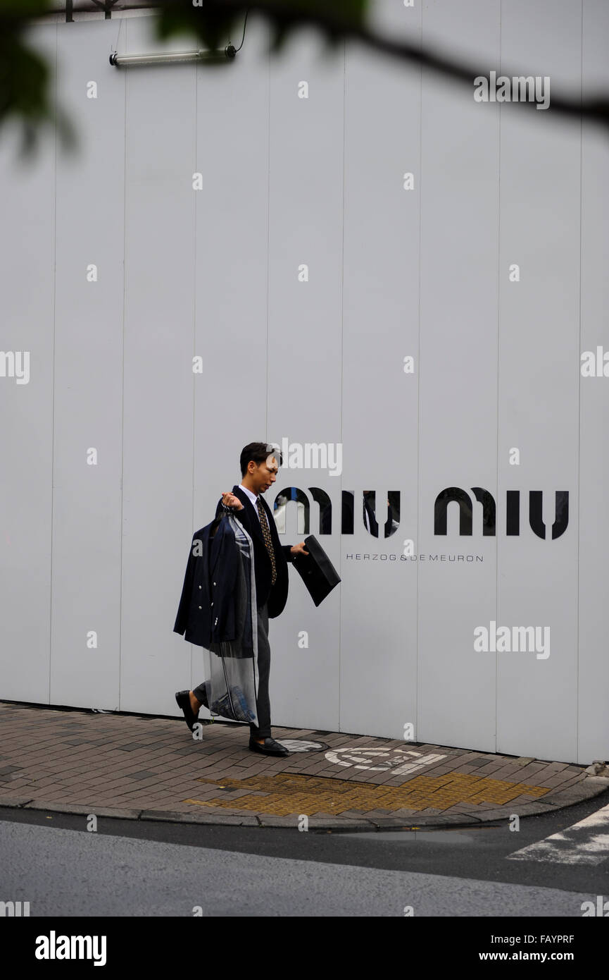 Man walking in the luxury and fashion district of Omotesando Tokyo Japan Stock Photo