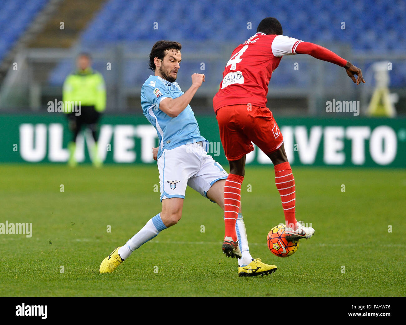Marco Parolo fights for the ball with Isaac Cofie during the Italian Serie A football match S.S. Lazio vs F.C. Carpi at the Olympic Stadium in Rome, on January 06, 2016. Stock Photo