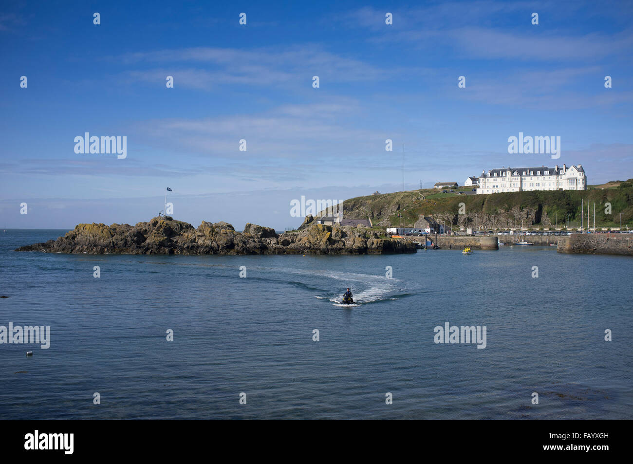 Portpatrick Cliffs A jet ski rider in the harbour at Portpatrick, Dumfries and Galloway ...
