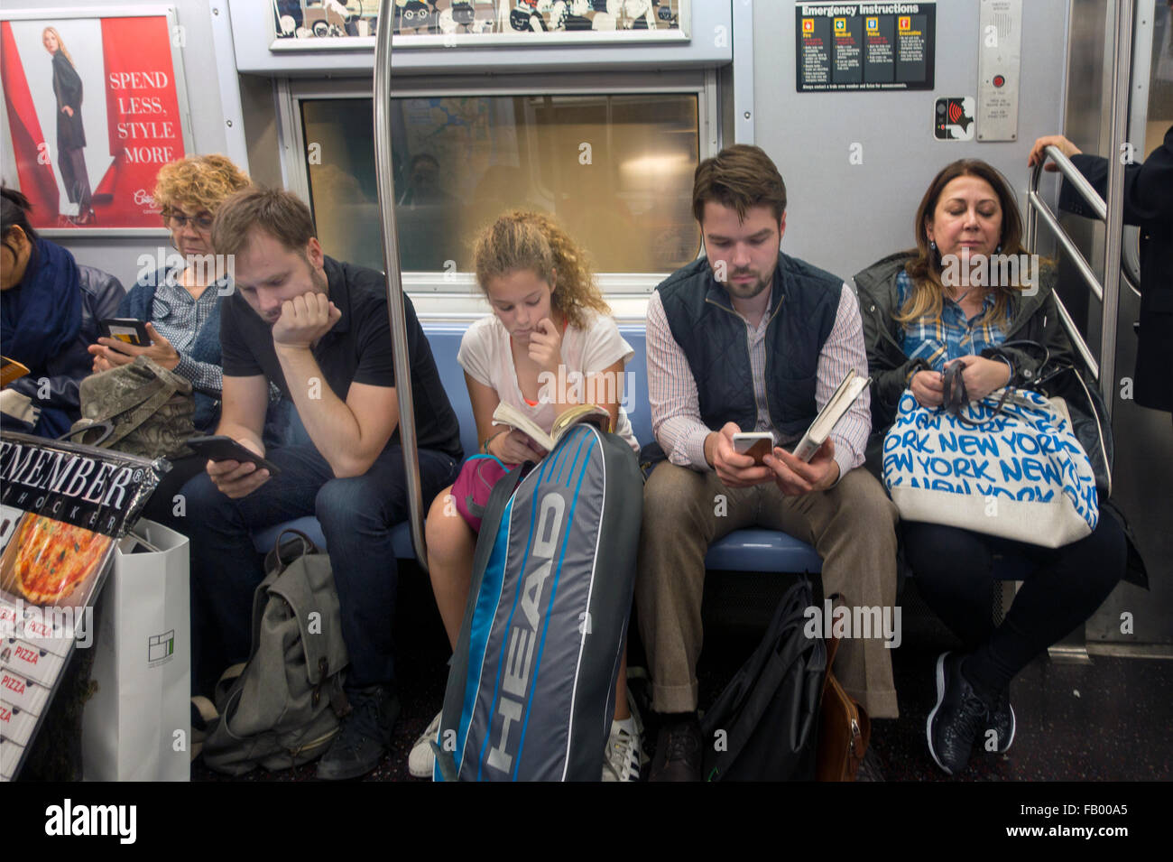 people reading and texting in subway car in NYC Stock Photo Alamy