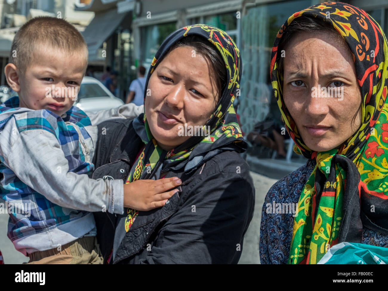 Three Afghan refugees arrive in the port of Mytillene after crossing in a raft from Turkey. Stock Photo