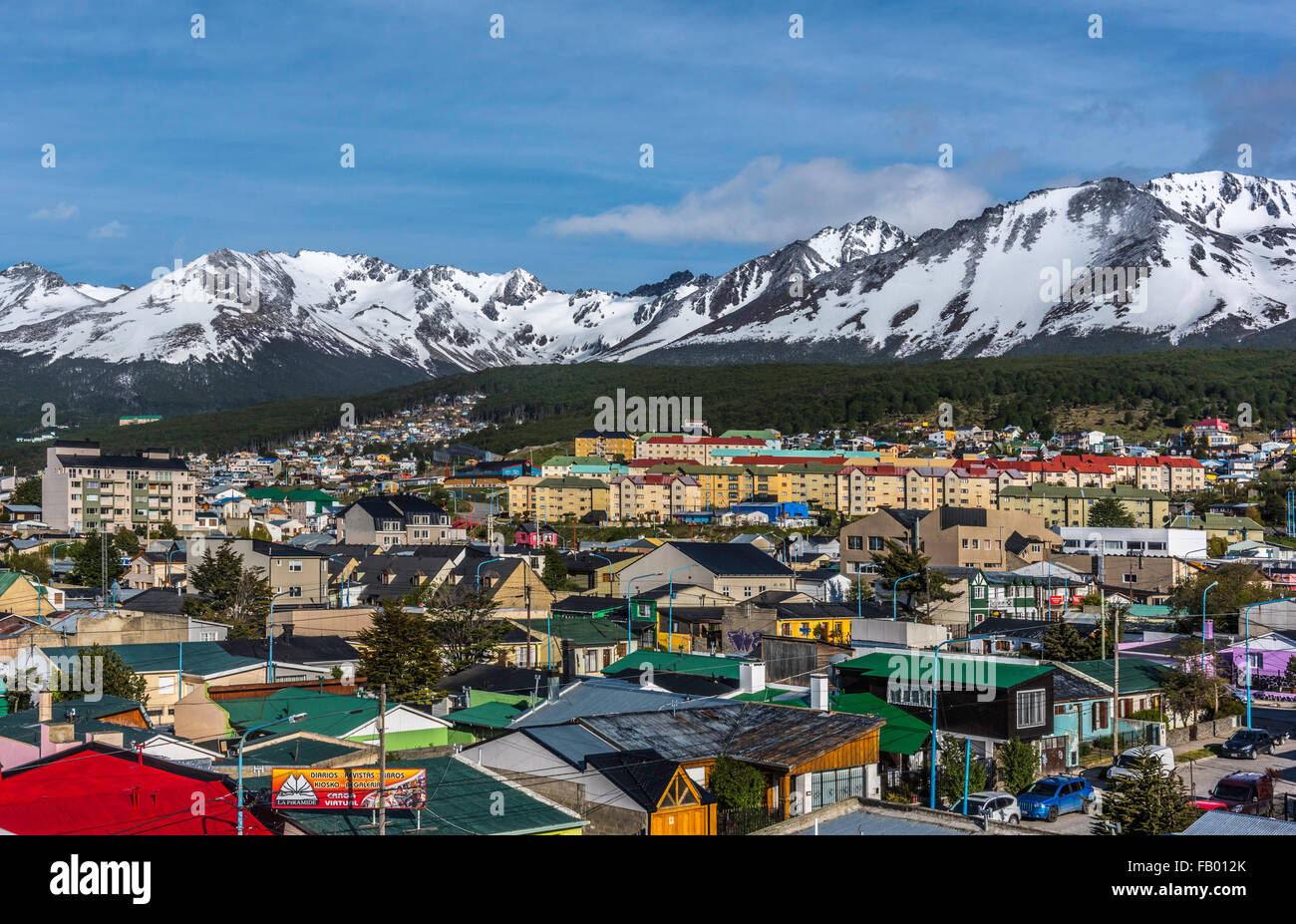 Colourful houses in the Patagonian city of Ushuaia, Argentina, with the snow covered Martial Mountains in the background Stock Photo