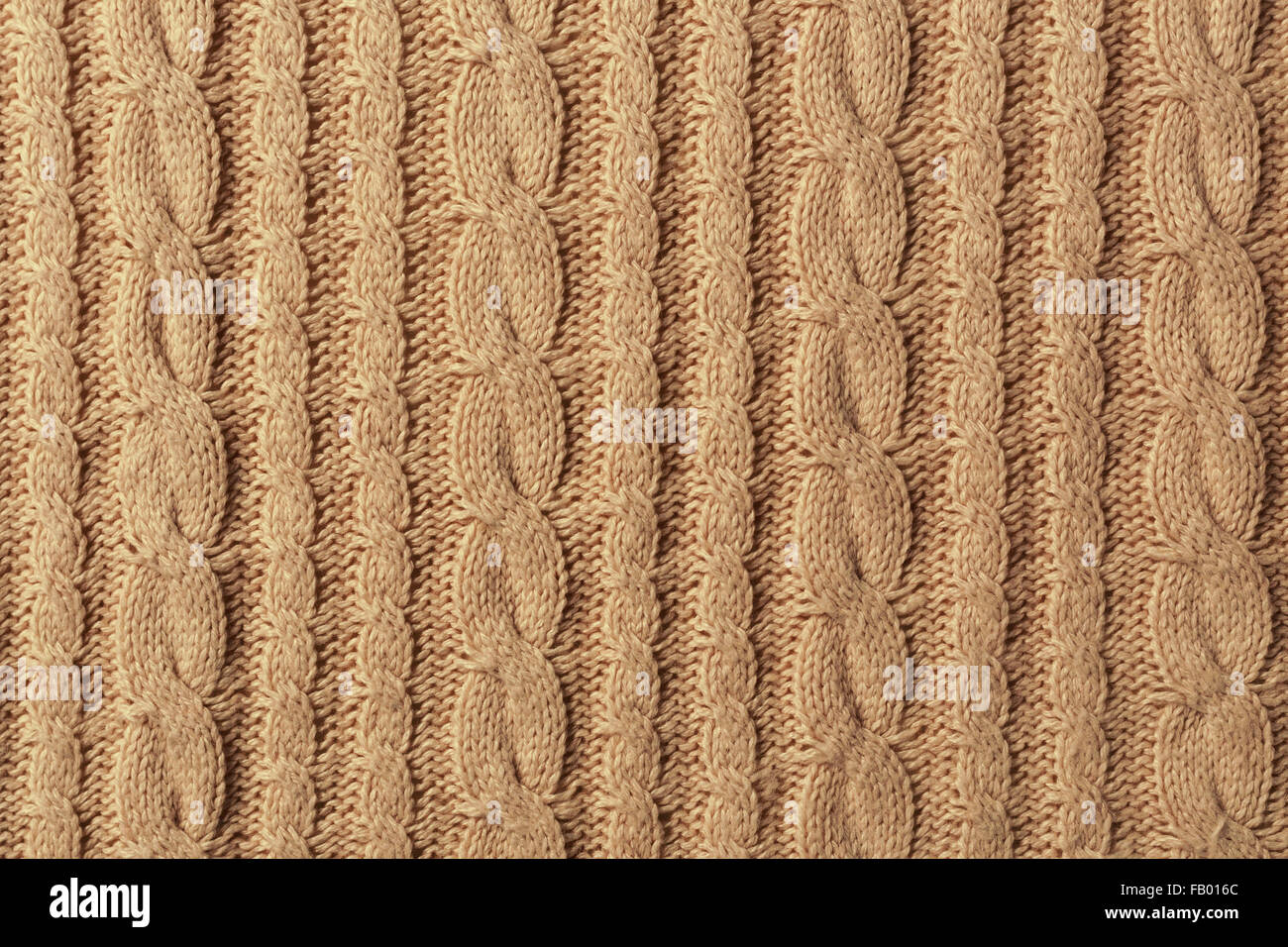 Knit Texture Of Light Natural Wool Knitted Fabric With Cable