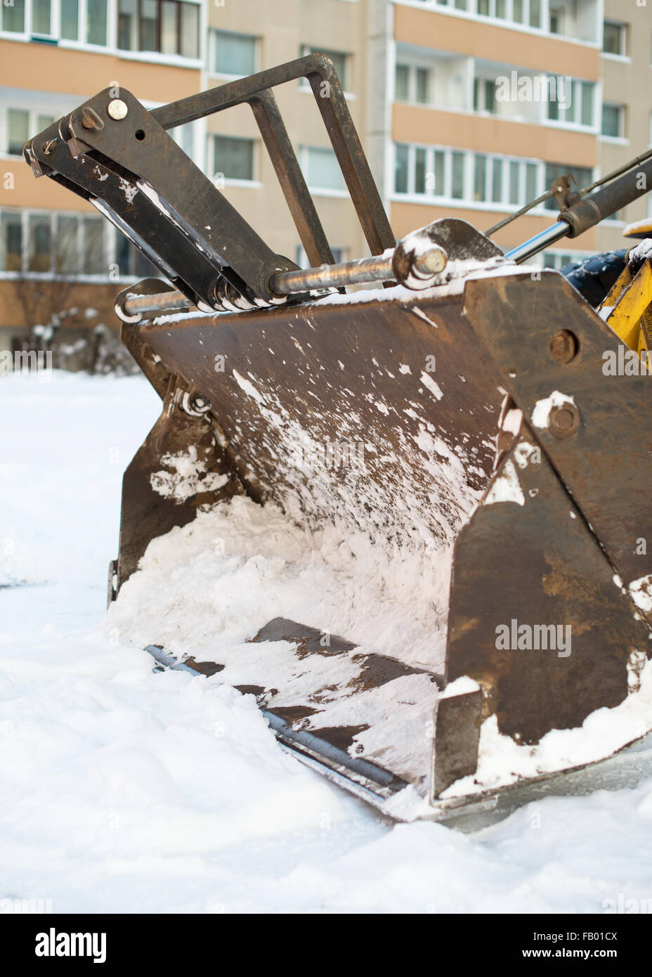 Tractor is ready to clear snow on the street. Stock Photo