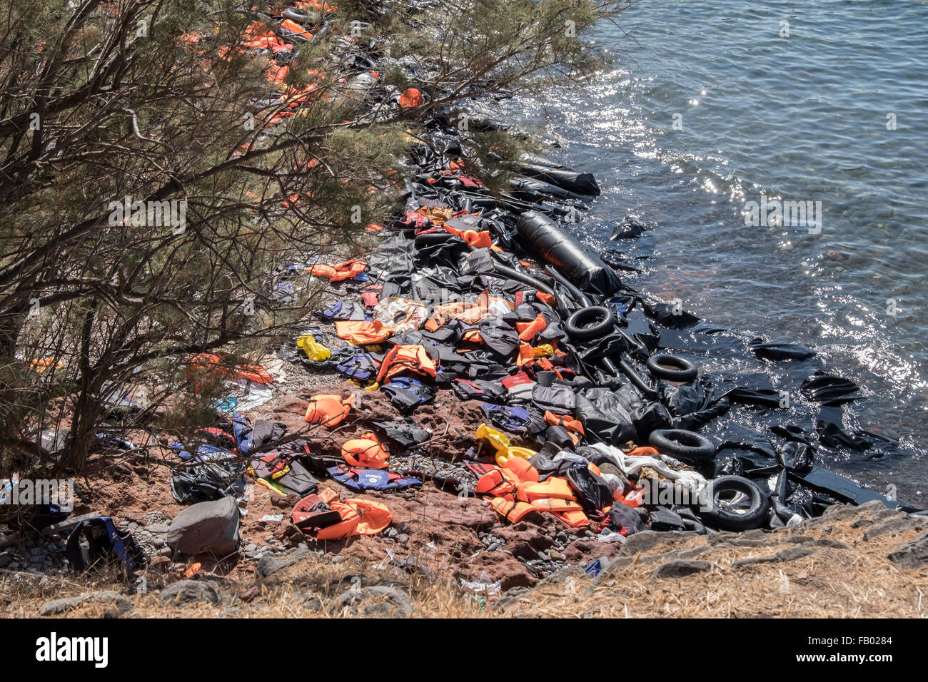 Life vests, deflated rafts and other detritus left behind by refugees crossing from Turkey to Lesvos, Greece. Stock Photo
