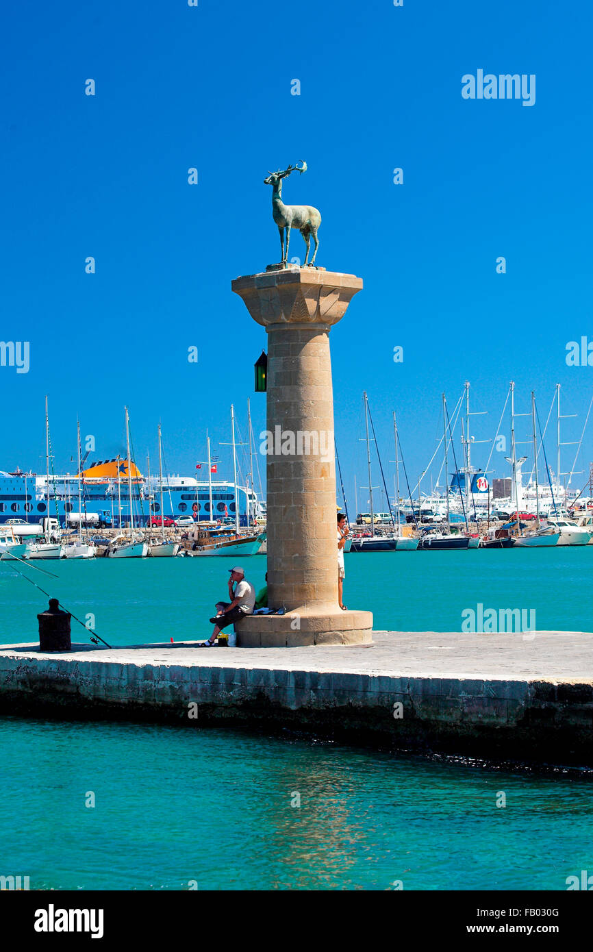 Mandraki harbour and fortress Agios Nicolaos in Rhodes town, Rhodes Island, Greece, UNESCO Stock Photo