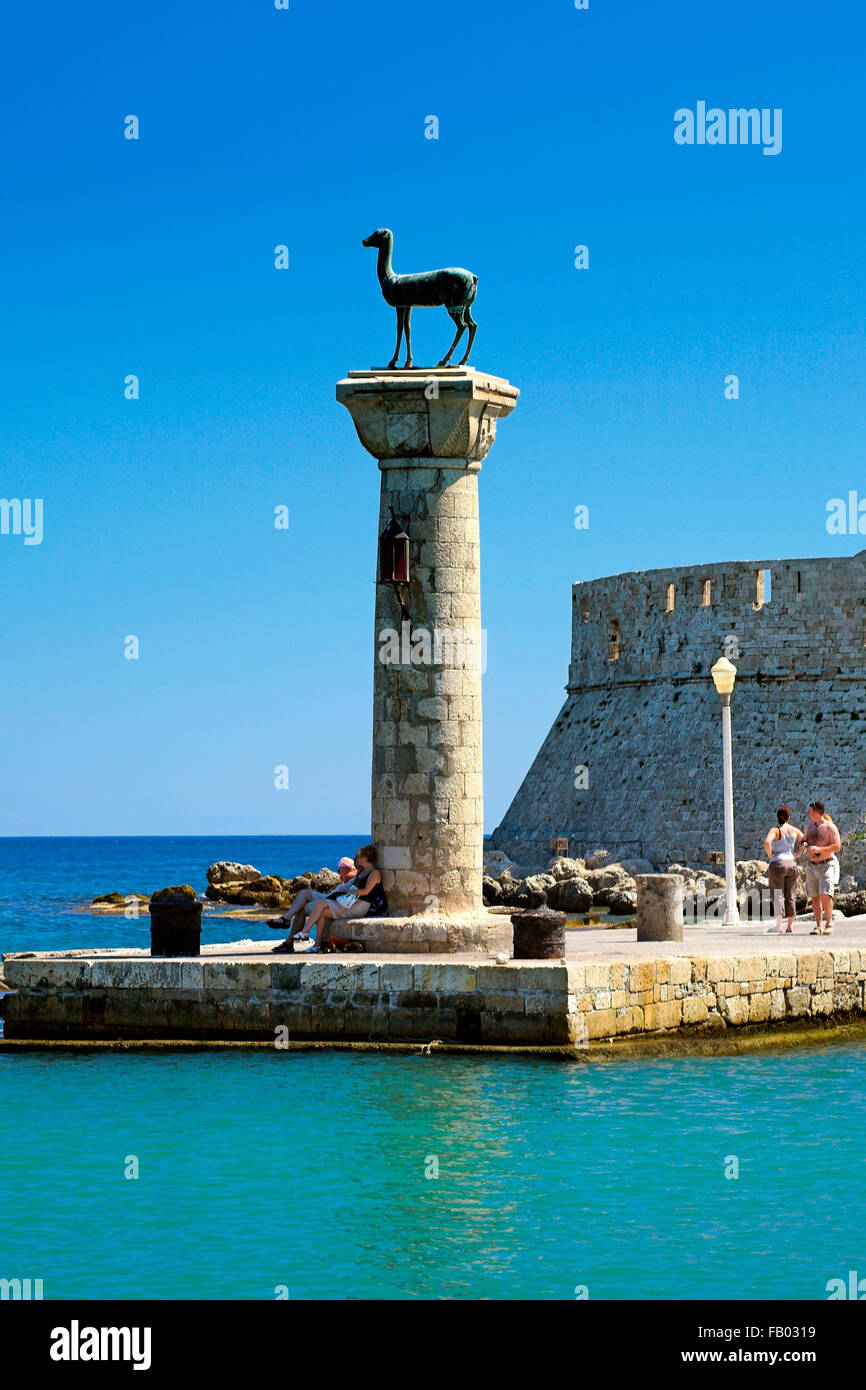 Mandraki harbour and fortress Agios Nicolaos in Rhodes town, Rhodes Island, Greece, UNESCO Stock Photo