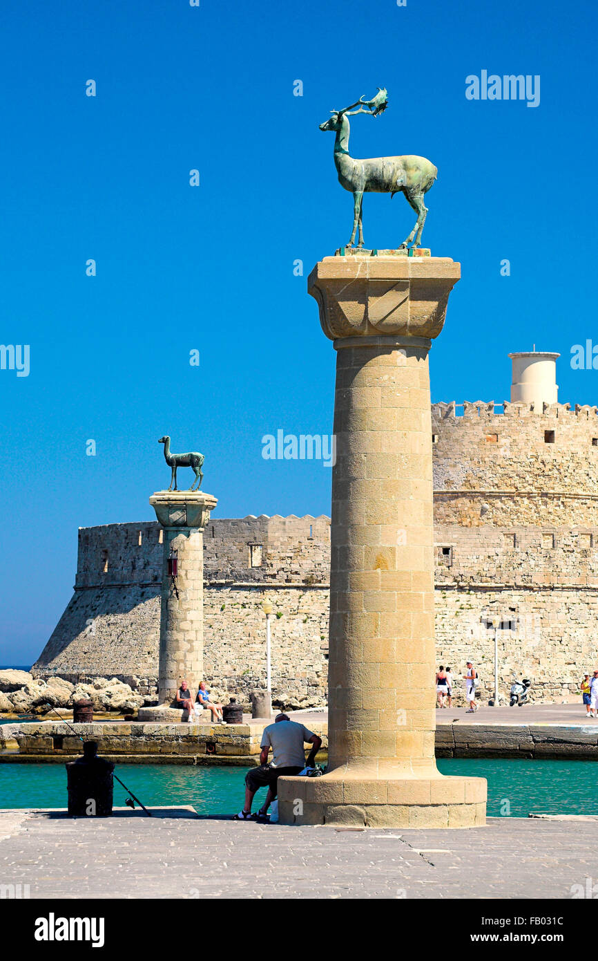 Mandraki harbour and fortress Agios Nicolaos in Rhodes town, Rhodes Island, Greece, UNESCO Stock Photo