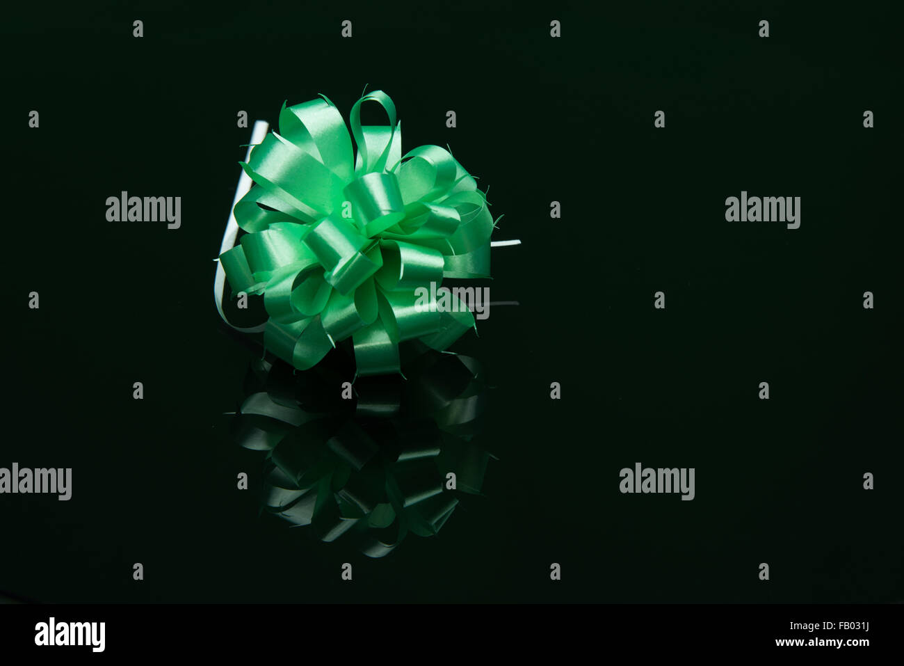 Green Ribbon on black background Stock Photo - Alamy