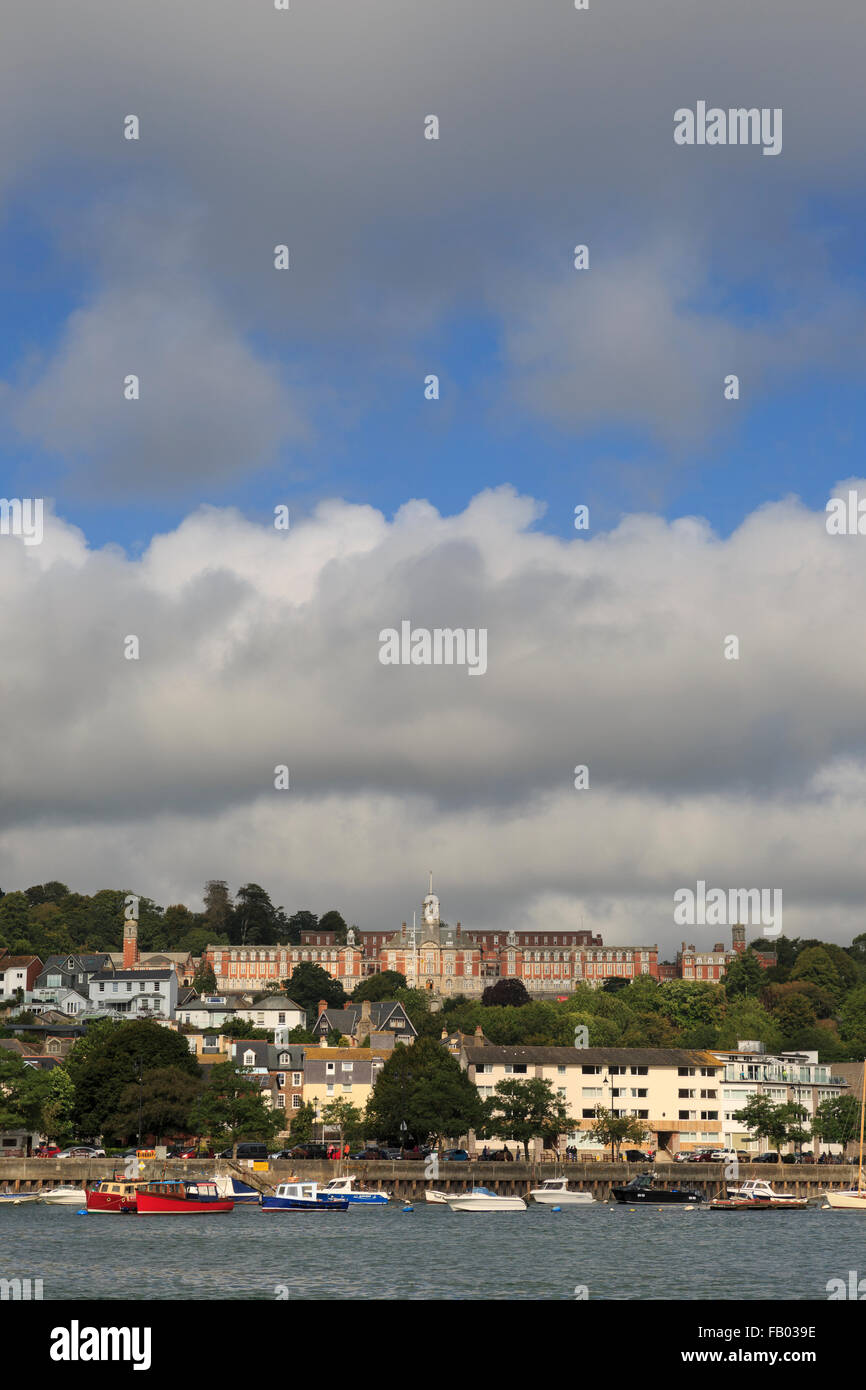 The Britannia Royal Naval College (HMS Dartmouth) dominates the skyline above Dartmouth, Devon, on a partly-cloudy summer's day Stock Photo