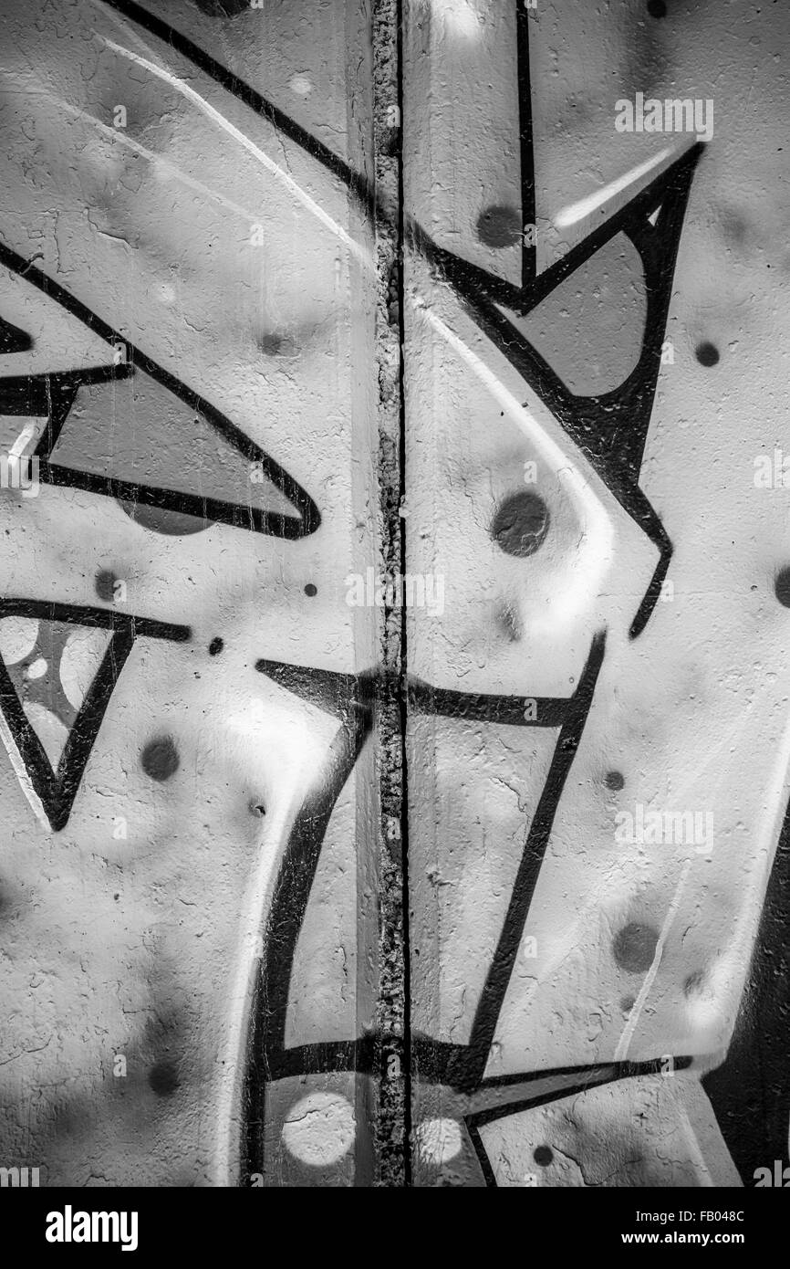 font, a city wall with graffiti in black and white, urban art Stock Photo