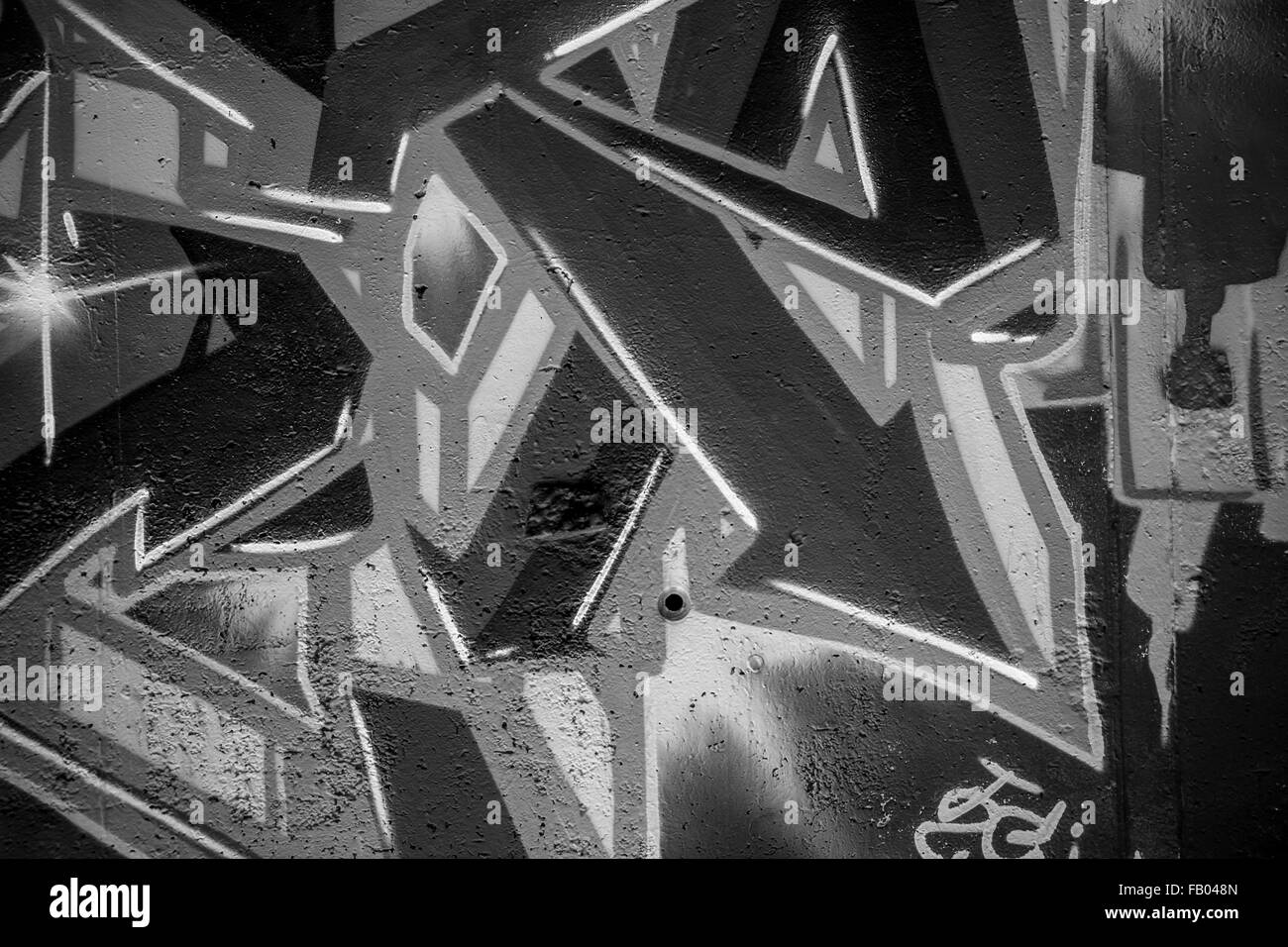 font, a city wall with graffiti in black and white, urban art Stock