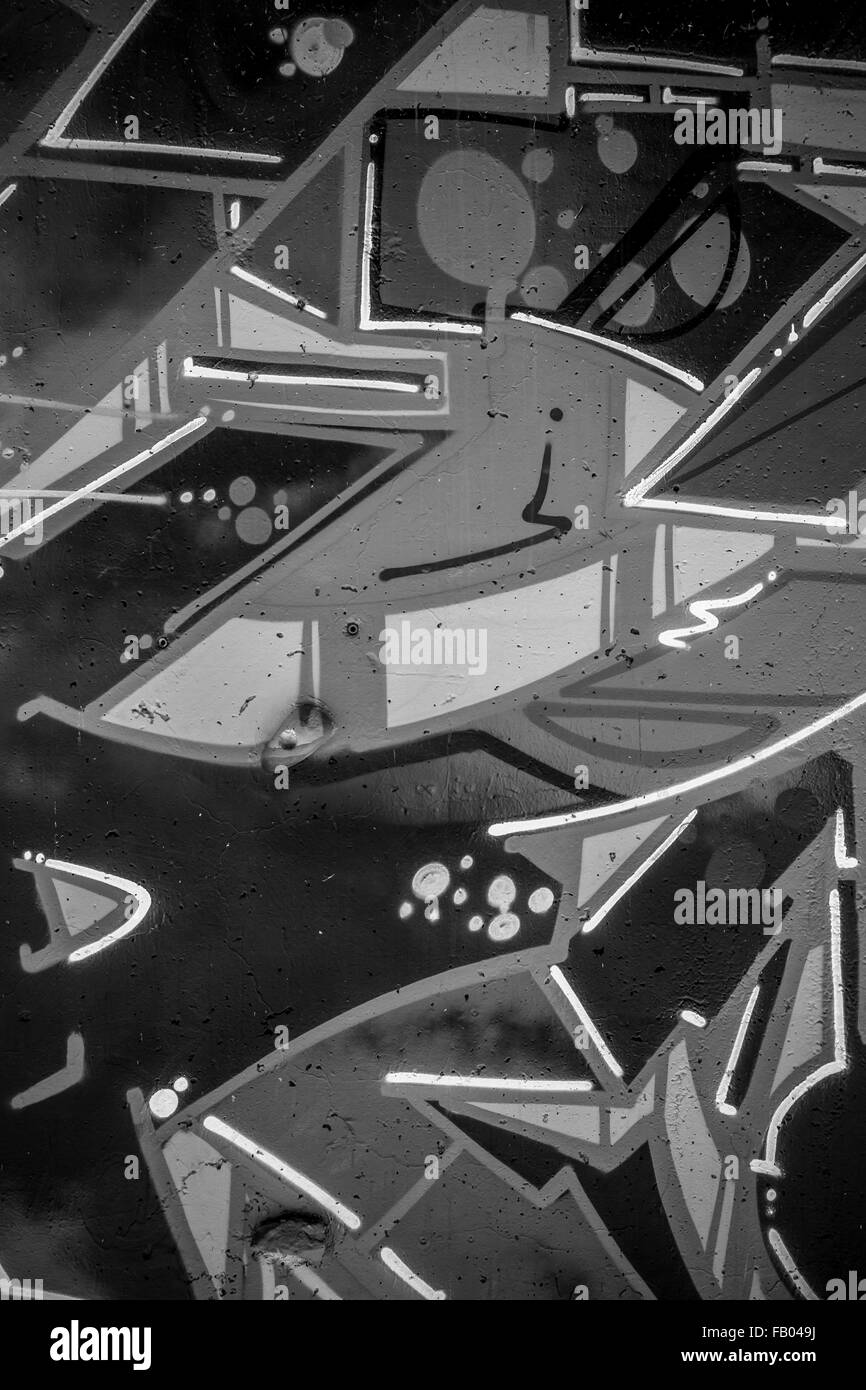 abstract, a city wall with graffiti in black and white, urban art Stock