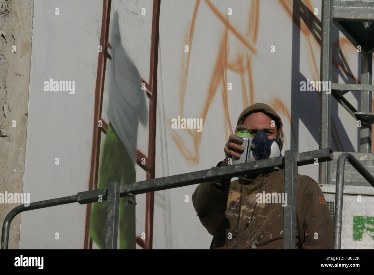 Arzano, Italy. 06th Jan, 2016. Jorit Agoch, an artist, paints to the facade of the under renovation building with a giant mural. Credit:  Salvatore Esposito/Pacific Press/Alamy Live News Stock Photo
