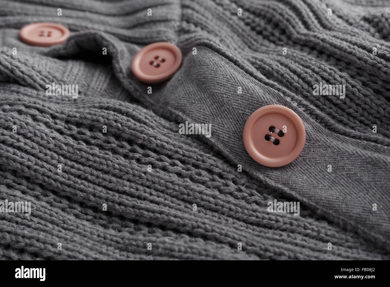 Knit sweater closeup button Stock Photo Alamy